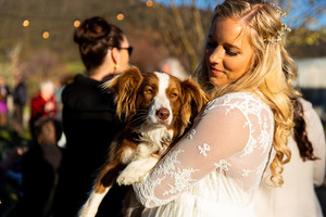 Next Chapter Photography Pic 4 - The gorgeous boho bride cuddles her dog at their country Blue Mountains wedding