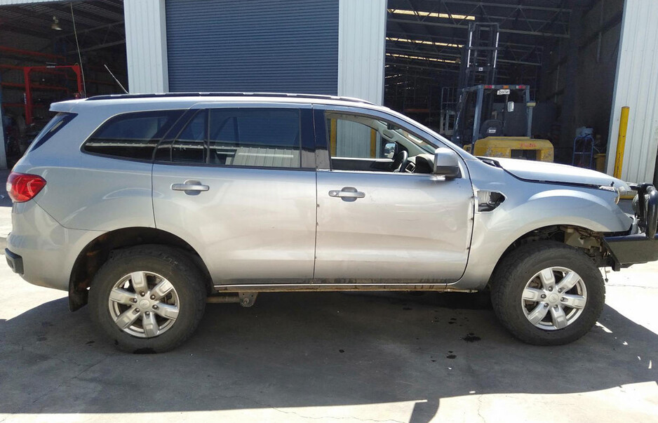 Ford Wreckers Adelaide Pic 1 - Damaged silver Ford Everest SUV with a missing front bumper at Salisbury Auto Parts Ford Wreckers Adelaide