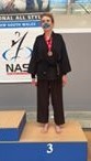 Women's ABC Self-defence Pic 2 - Amanda McMillan on the podium after winning a bronze medal in the continuous sparring at the National All Styles Championships in Sydney