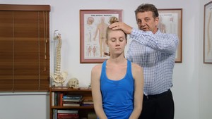 Ansell Chiropractic Centre Pic 2 - Townsville Chiropractor examining a patient with neck pain