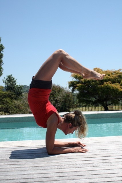 The Business of Yoga Pic 1 - yoga by the pool