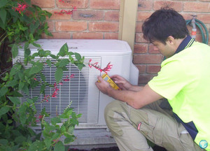 Fairbairns Heating & Cooling Pty Ltd Pic 3 - Checking refrigerant levels in Outdoor unit of Split System Air Conditioner