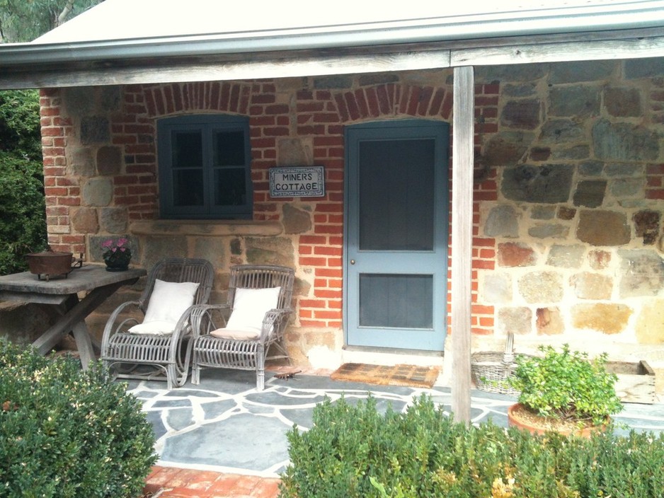 Miners Cottage Pic 1 - Sink into comfy antique chairs and the watch the sun set with a glass of wine A perfect end to of a day of exploring