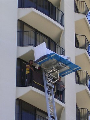 King Hoists Pic 2 - a sofa being unloaded onto a balcony