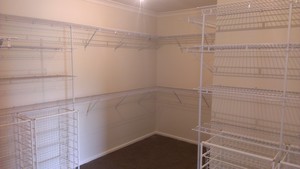 Wardrobe World Pic 2 - Walk in Robe with Fixed Ventilated Shelving Design