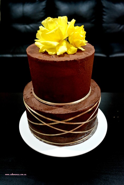 Cakewaves Pic 1 - 2 Tier Wedding CakeChocolate flavour with Chocolate buttercream frosting Decorated with white silk ribbon and fresh flower