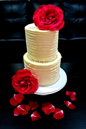 Cakewaves Pic 2 - 2 Tier rustic wedding cake Vanilla flavored with vanilla buttercream frosting with fresh flower decoration